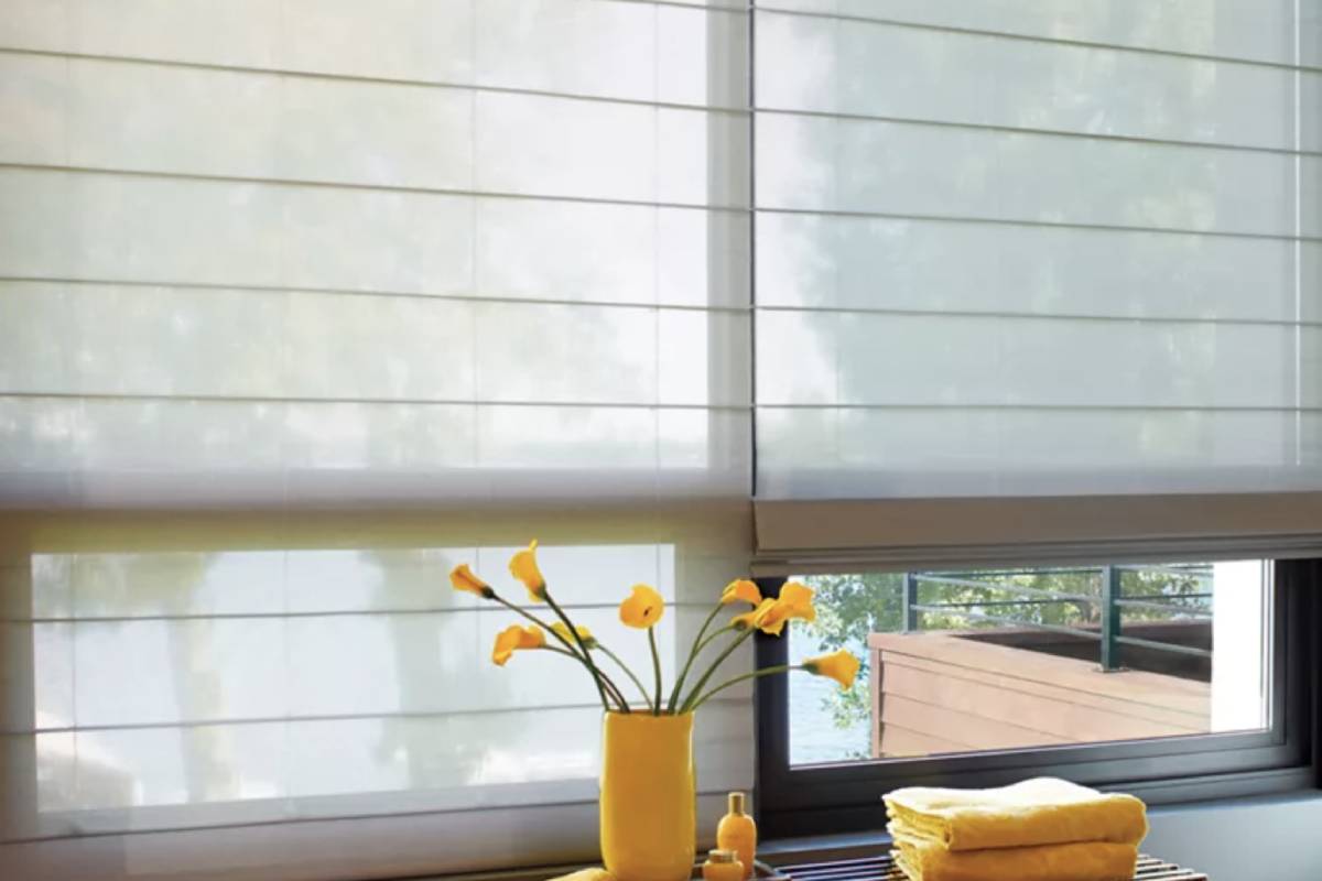 Hunter Douglas Alustra® Woven Shades blocking light near a windowsill near Helena, MT